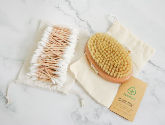 Plantish Future Beauty and Bathroom Dry Body Brush (medium-firm) beside cotton buds top view